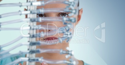 Close up of woman through electronics against blue background