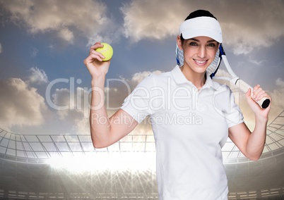Tennis player against stadium with bright lights and sky with clouds