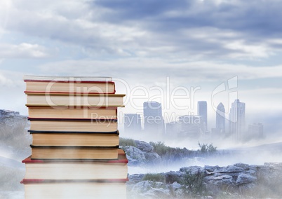 Books stacked by distant city