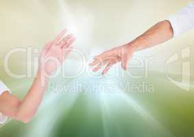 Hands reaching for eachother against abstract background