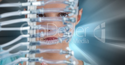 Close up of woman through electronics against blue motion blur