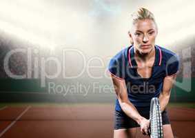 Tennis player on court with audience and bright lights