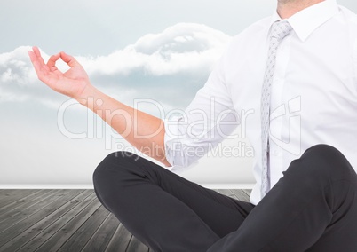 Man Meditating peaceful by clouds