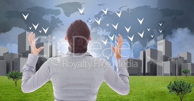 Businesswoman powerful with hands crooked open looking at City with world map