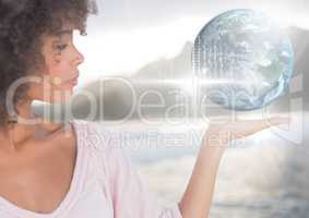 Woman with open palm hand holding world earth globe interface
