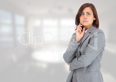 Anxious businesswoman against bright background