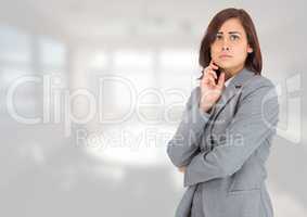 Anxious businesswoman against bright background