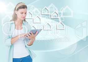 Woman with tablet against white house graphics and blue background