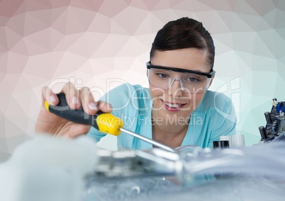 Woman with electronics against green and pink vector mesh