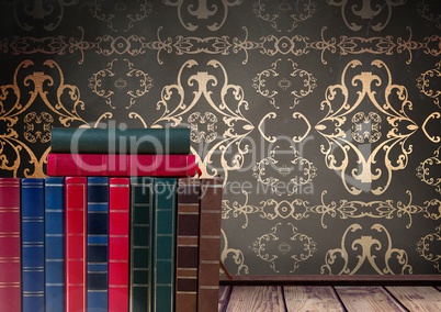 Books stacked by wallpaper antique decorative