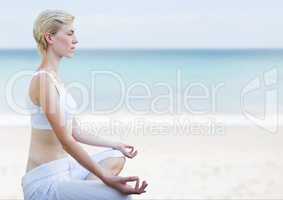 Woman Meditating peaceful on beach