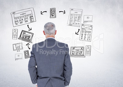 Businessman with business graphics drawings