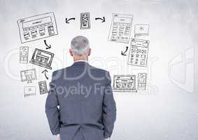 Businessman with business graphics drawings