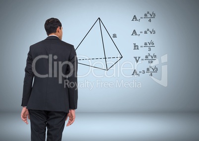 Businessman looking at equations graphic drawings