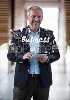 Business man smiling with tablet covered with white business doodles