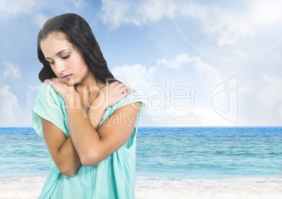 Sad young woman against beach sea