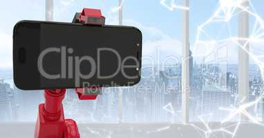 Red robot claw holding phone against white interface and window with skyline