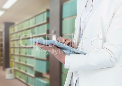 Womans tablets holding tablet in Library