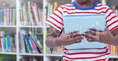 child on tablet in Library