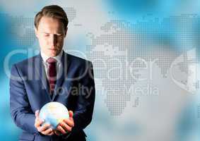 Man with globe against blue map