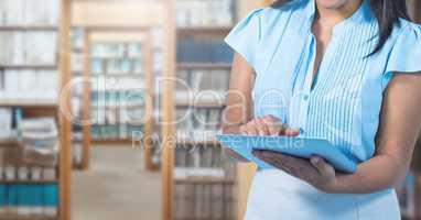 Woman on tablet in Library