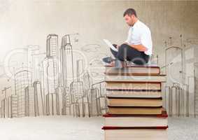 Businessman sitting on Books stacked by city drawings