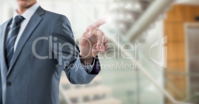 Business man mid section with flare against blurry stairs