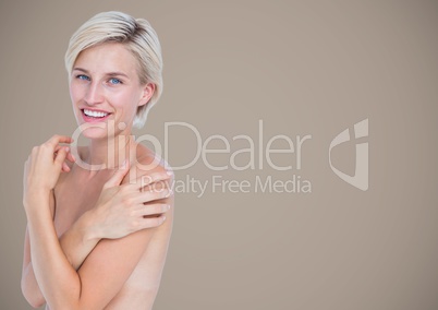 Topless woman arms crossed against brown background