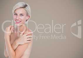 Topless woman arms crossed against brown background