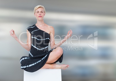 Woman Meditating peaceful against motion blur background
