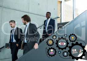 Three business men walking down stairs and black gear graphics