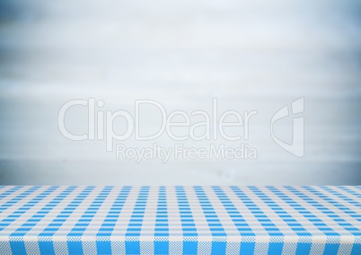 Picnic table against blurry grey wood panel