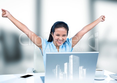 Woman at desk with hands in air behind white graphic of buildings and against blurry grey window