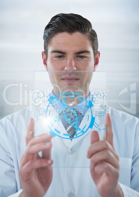 Man in lab coat holding up glass device with blue medical interface and flare against grey backgroun