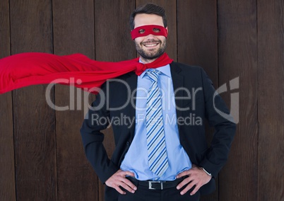 Business Superhero against wood