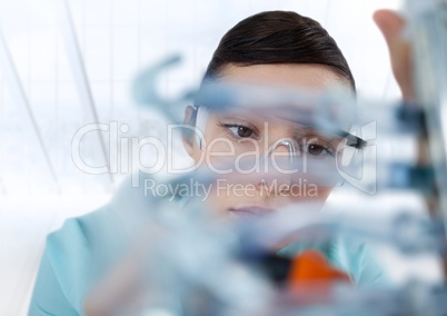Close up of woman with electronics against blurry window