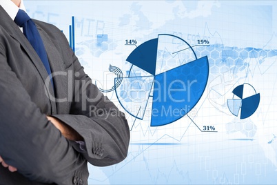 Business man with hands folded against background with financial graphs