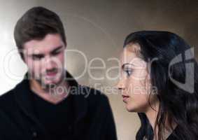 Sad couple against brown background