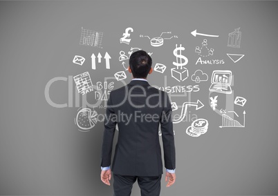 Businessman looking at Business graphics drawings