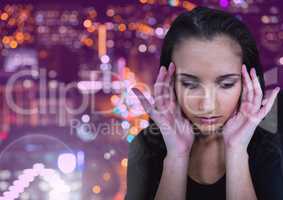 Woman stressed against city at night