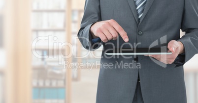 man touching tablet in Library