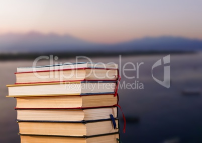 Books stacked by harbour