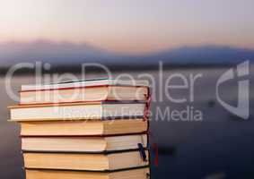 Books stacked by harbour