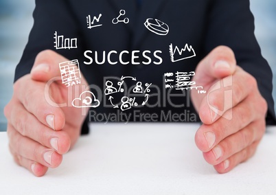 Business man hands on table with white doodles