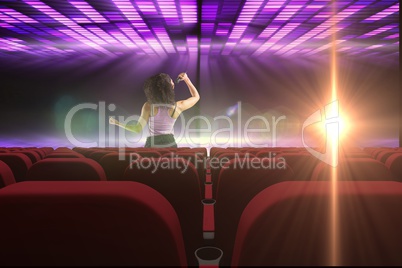 singer performing  in front of 3d empty cinema