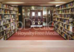 Wood table against blurry library