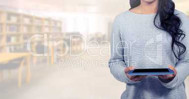 woman with tablet in Library