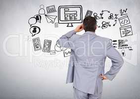 Businessman with business graphics drawings