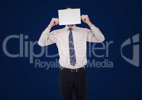 Business man holding blank card over face against navy background
