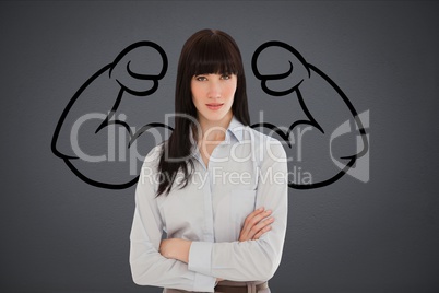 Confident business woman against grey background with drawing of  flexing muscles
